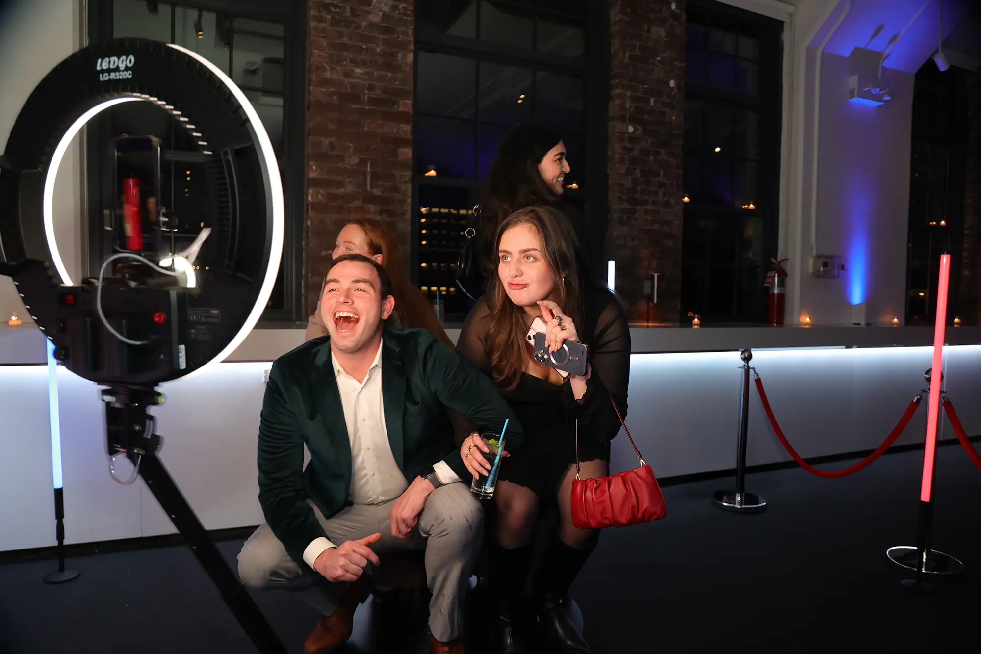 Photo Booth Rental NYC Event Experience | Mashbooths Modern Photo Booth Rentals Guests enjoying a photo booth experience at a NYC event with ring light and camera setup