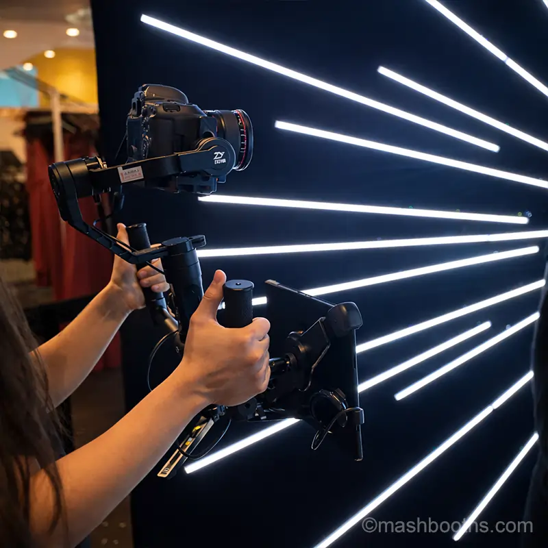 Cinematic Camera Setup for Video Booth Rental NYC | Mashbooths Modern Photo Booth Rentals Guests posing for a Vogue-style photo booth experience with professional studio lighting creating high-fashion editorial portraits at an NYC event.