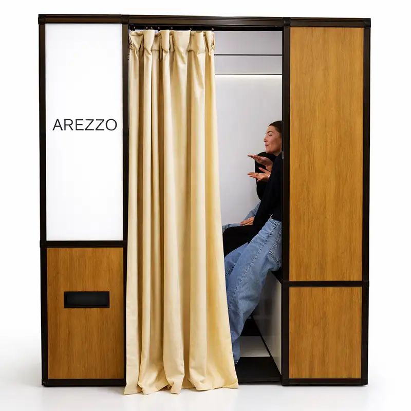 classic-retro-wooden-vintage enclosed-photobooth | Mashbooths Modern Photo Booth Rentals NYC influencers using vintage enclosed photo booth at Arezzo brand activation