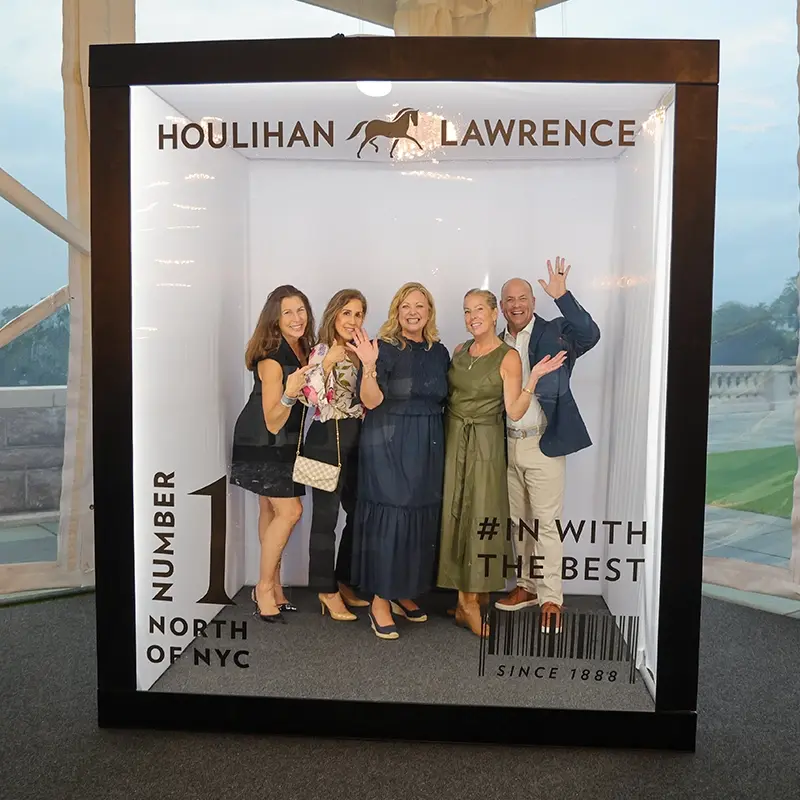 magazine-photobooth-nyc | Mashbooths Modern Photo Booth Rentals Guests posing for custom magazine cover photo booth experience