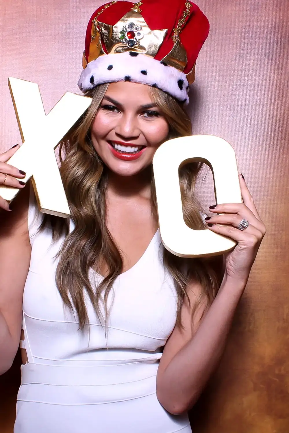 Chrissy Teigen photo booth experience at corporate event in NYC with branded props